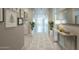 Inviting hallway with neutral paint, contemporary decor and natural light at 4215 W Suncup Dr, San Tan Valley, AZ 85144