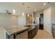 Spacious kitchen island with stainless steel appliances, granite countertops, and ample counter space at 4215 W Suncup Dr, San Tan Valley, AZ 85144