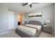 Relaxing main bedroom with a luxurious bed, soft lighting, and ensuite bathroom at 4215 W Suncup Dr, San Tan Valley, AZ 85144