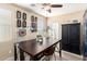Bright craft room featuring custom lighting, shelving, and ample workspace at 44041 W Bailey Dr, Maricopa, AZ 85138