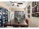 Home craft room with a ceiling fan, large work table, and storage at 44041 W Bailey Dr, Maricopa, AZ 85138