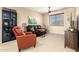 Cozy living room featuring comfortable seating, stylish decor and ample natural light at 44041 W Bailey Dr, Maricopa, AZ 85138
