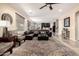 Open living area with plush seating, modern decor, and seamless flow into the kitchen at 44041 W Bailey Dr, Maricopa, AZ 85138