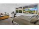 Bright bedroom features a large window overlooking the scenic landscape with a dedicated workspace at 4411 N 40Th St # 59, Phoenix, AZ 85018
