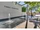 Stunning water feature with 'THREE FOUNTAINS' inscribed on the wall, surrounded by lush greenery at 4411 N 40Th St # 59, Phoenix, AZ 85018