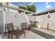 The inviting patio features modern outdoor furniture and a gravel landscape, perfect for relaxation at 4411 N 40Th St # 59, Phoenix, AZ 85018