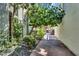 Charming walkway featuring lush landscaping, decorative rocks, and a glimpse of a parked car at 4411 N 40Th St # 59, Phoenix, AZ 85018