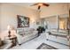 Comfortable living room featuring plush seating, bright neutral paint, and an art-filled space at 4531 W Continental Dr, Glendale, AZ 85308
