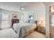 A serene main bedroom boasting natural light, a ceiling fan, and cozy furnishings at 4531 W Continental Dr, Glendale, AZ 85308