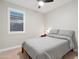 Neutral bedroom featuring one window and a ceiling fan at 506 E Balao Dr, Phoenix, AZ 85085