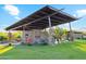 Community outdoor pavilion with fireplace, grill, and seating for social gatherings at 506 E Balao Dr, Phoenix, AZ 85085