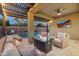 Outdoor patio featuring a pool, outdoor tv, and fire pit at 506 E Balao Dr, Phoenix, AZ 85085