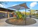 Community playground area with sunshade and nearby restroom facilities at 506 E Balao Dr, Phoenix, AZ 85085