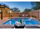 Stunning pool with waterfall feature and a lounge area, great for outdoor relaxation at 506 E Balao Dr, Phoenix, AZ 85085
