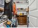 A walk-in closet that has a lot of storage for clothing, shoes, and other items at 506 E Balao Dr, Phoenix, AZ 85085