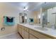 A spacious bathroom with dual sinks, a large mirror, and good lighting, offering functionality and comfort at 5347 W Seldon Ln, Glendale, AZ 85302