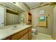 Bathroom with an extended vanity, updated lighting, and warm, earthy tones for a relaxing atmosphere at 5347 W Seldon Ln, Glendale, AZ 85302