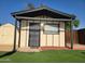 View of outdoor outbuilding with decorative security door and window at 5347 W Seldon Ln, Glendale, AZ 85302
