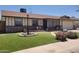 Inviting single-story home with a well-kept lawn and landscaped front yard with charming brick accents at 5347 W Seldon Ln, Glendale, AZ 85302