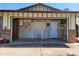 A spacious garage with a pegboard wall, cabinets, and ample room for parking and storage at 5347 W Seldon Ln, Glendale, AZ 85302