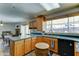 Classic kitchen with light wood cabinets, contrasting blue countertops, and stainless steel appliances at 5347 W Seldon Ln, Glendale, AZ 85302