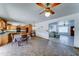 Open concept kitchen with brick floors seamlessly flowing into the Gathering room at 5347 W Seldon Ln, Glendale, AZ 85302
