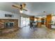 Spacious kitchen with a brick fireplace, natural light, and a sliding glass door at 5347 W Seldon Ln, Glendale, AZ 85302