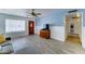 Comfortable living room featuring wood-look floors and an entertainment cabinet at 5347 W Seldon Ln, Glendale, AZ 85302