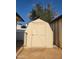 Exterior view of the shed with latch and partial fence at 5347 W Seldon Ln, Glendale, AZ 85302