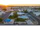 Overhead view of a community pool area with parking, clubhouse, green spaces, and amenities, perfect for residents at 535 S Alma School Rd # 85, Mesa, AZ 85210