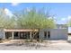 Charming community entrance with a covered walkway and lush landscaping at 535 S Alma School Rd # 85, Mesa, AZ 85210