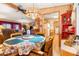 Dining area with a decorative chandelier and seamless access to the living room and kitchen at 535 S Alma School Rd # 85, Mesa, AZ 85210