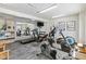 Well-equipped fitness center featuring treadmills, elliptical machines, stationary bikes, and free weights at 535 S Alma School Rd # 85, Mesa, AZ 85210