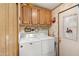Practical laundry room with washer, dryer, and ample storage in a compact space at 535 S Alma School Rd # 85, Mesa, AZ 85210