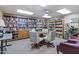 Cozy library features built-in bookshelves with a variety of titles and comfortable seating around a table at 535 S Alma School Rd # 85, Mesa, AZ 85210