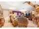 Comfortable living room showcasing neutral carpet, wood trim, and plenty of natural light at 535 S Alma School Rd # 85, Mesa, AZ 85210