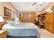 Comfortable bedroom with a large bed, closet space, and dedicated desk area at 535 S Alma School Rd # 85, Mesa, AZ 85210