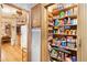 Organized pantry with extensive shelving, offering abundant storage next to kitchen area at 535 S Alma School Rd # 85, Mesa, AZ 85210