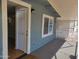 Exterior view of the front entrance with blue siding and a covered porch at 549 E Mckellips Rd # 18, Mesa, AZ 85203