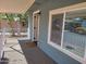 Home's exterior featuring a covered porch and a large window at 549 E Mckellips Rd # 18, Mesa, AZ 85203