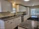 Modern kitchen with granite countertops, stainless steel appliances, and gas stove at 549 E Mckellips Rd # 18, Mesa, AZ 85203