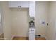 Convenient laundry area with granite countertops, storage cabinets, and washer hookups at 549 E Mckellips Rd # 18, Mesa, AZ 85203