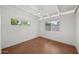 Bright bedroom with painted brick and two windows at 5815 N 10Th Pl, Phoenix, AZ 85014