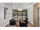 Dining room with a wood table, black chairs, and modern lighting fixture at 5815 N 10Th Pl, Phoenix, AZ 85014