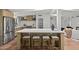 Modern kitchen island with seating, sleek countertops, and stainless steel appliances at 5815 N 10Th Pl, Phoenix, AZ 85014