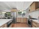 Bright kitchen with stainless appliances, white countertops, stylish backsplash and cabinetry at 5815 N 10Th Pl, Phoenix, AZ 85014