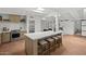 Stylish kitchen island with barstool seating complements the modern appliances and open layout at 5815 N 10Th Pl, Phoenix, AZ 85014