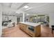 Modern kitchen island with seating, stainless steel appliances, and open layout at 5815 N 10Th Pl, Phoenix, AZ 85014