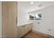 Bright laundry room with storage cabinets and a countertop at 5815 N 10Th Pl, Phoenix, AZ 85014
