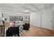 Bright, open living room with beamed ceilings and modern decor flows seamlessly into the kitchen at 5815 N 10Th Pl, Phoenix, AZ 85014